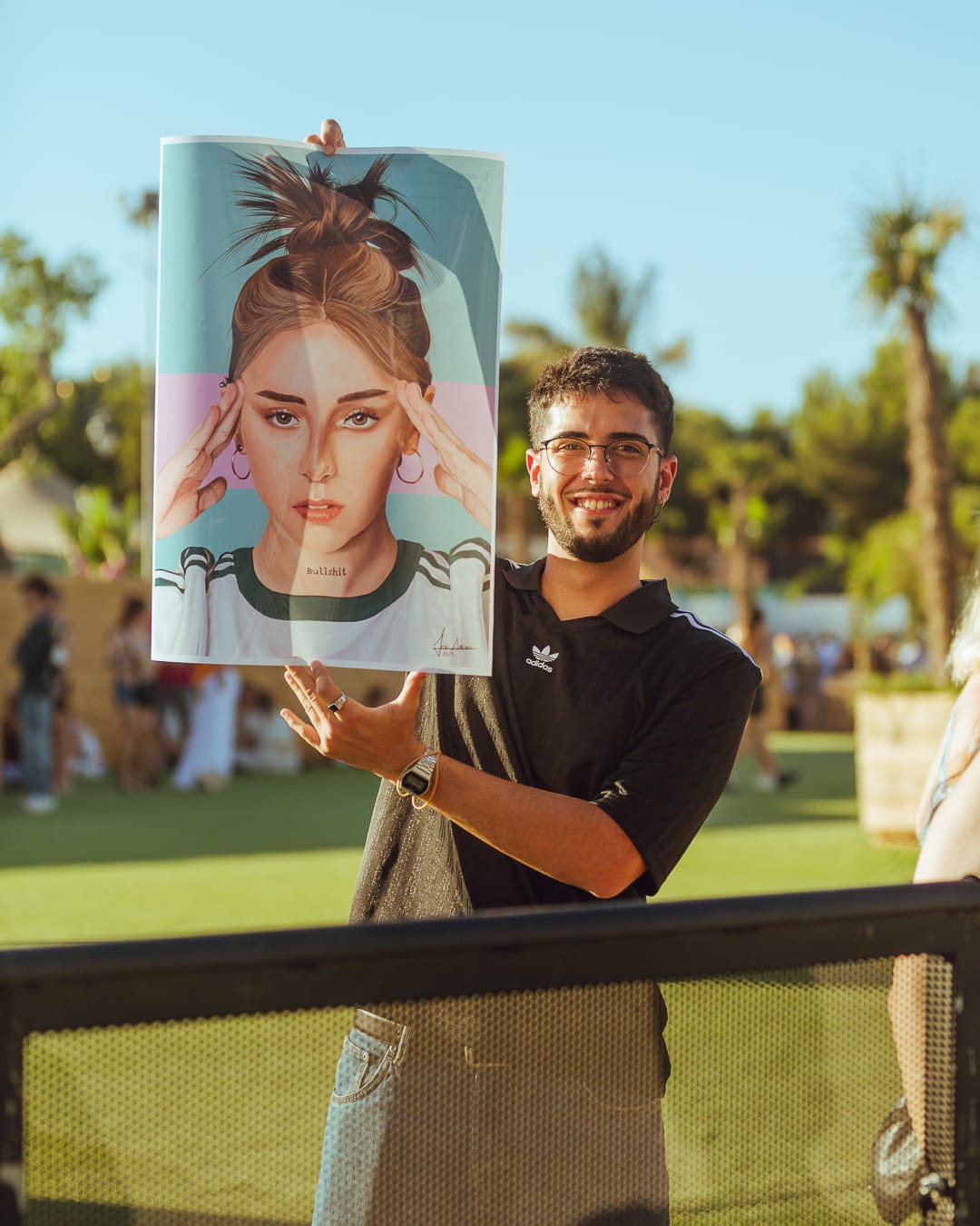 Brand activation at Málaga Forum with event guest holding a promotional visual