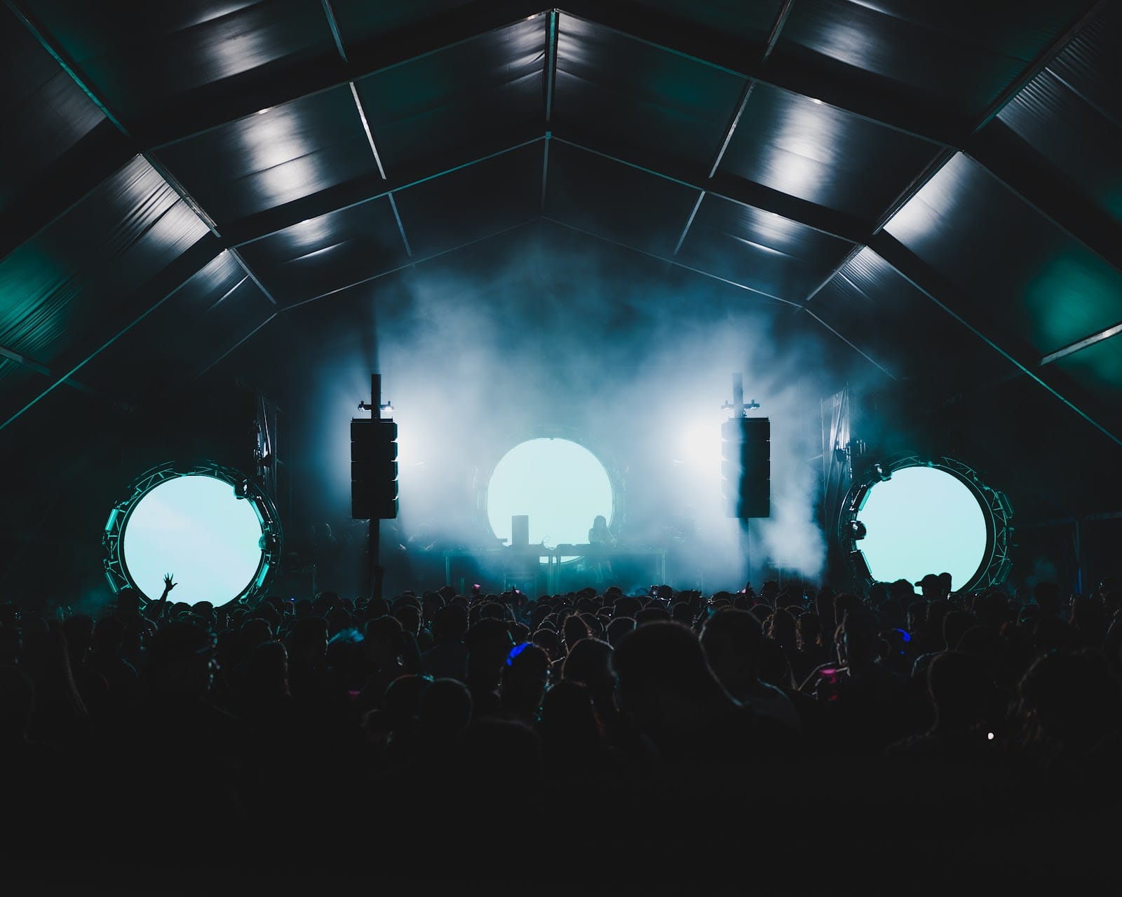 Indoor show production at Málaga Forum with stage lighting, smoke effects and live audience
