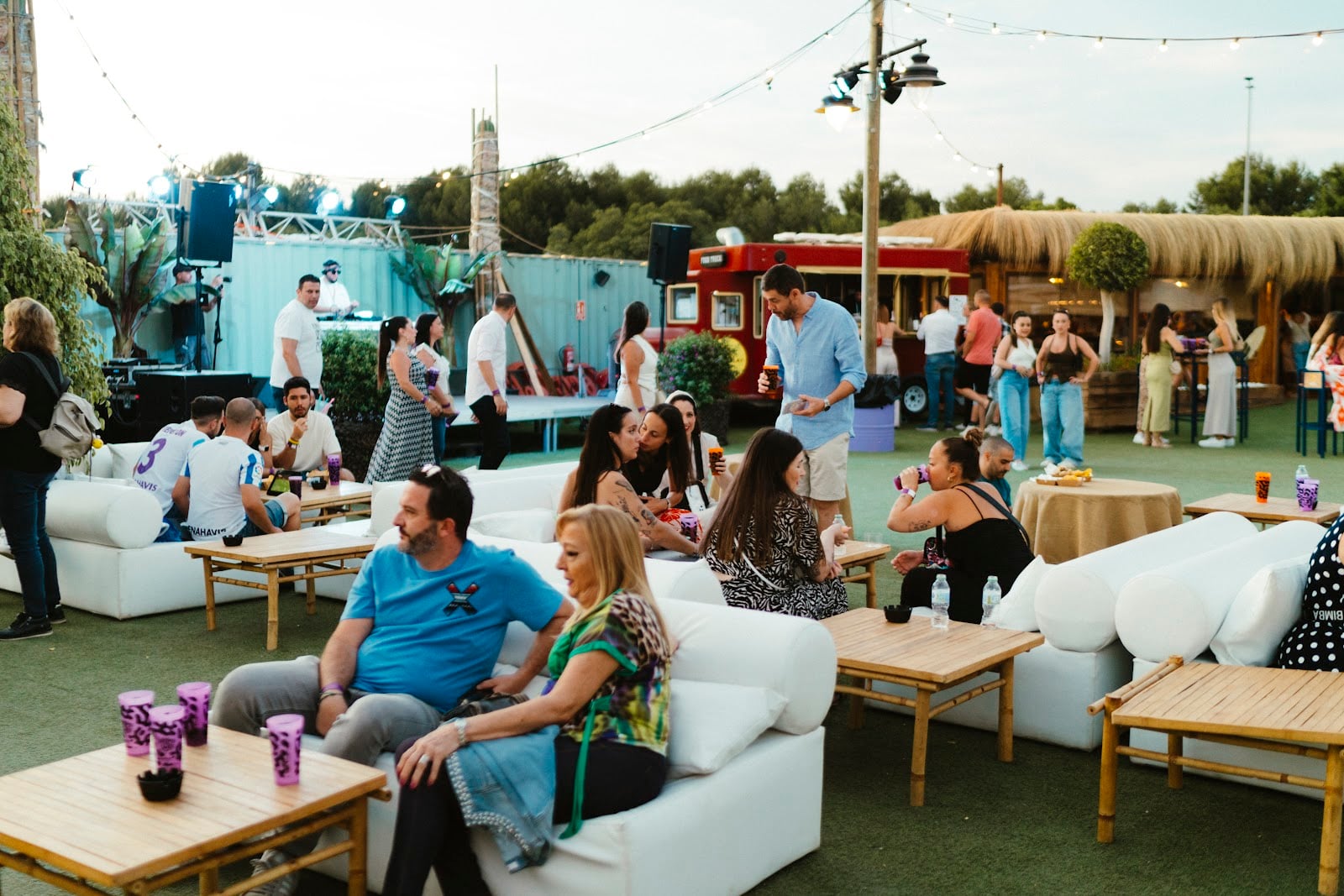 Outdoor lounge area at Málaga Forum with guests seated in an open-air event space