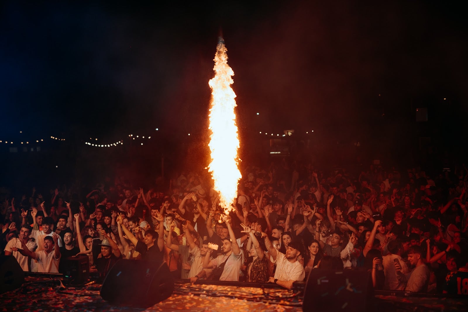 Night event crowd at Málaga Forum with pyrotechnics, stage effects and live audience