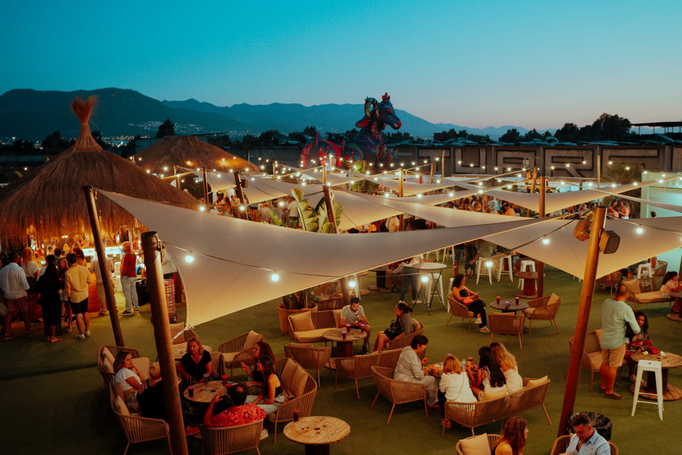 Village area at Málaga Forum with outdoor seating, lighting and social event atmosphere